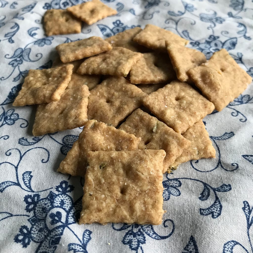 sourdough crackers on a white napkin with blue flowers