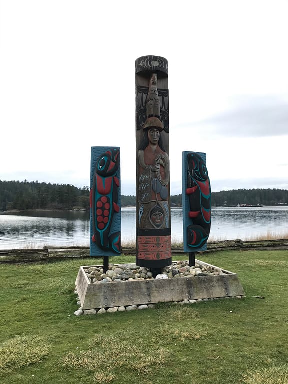 totem pole and Indian carvings of salmon overlook the bay... reminding us of who was really here first.